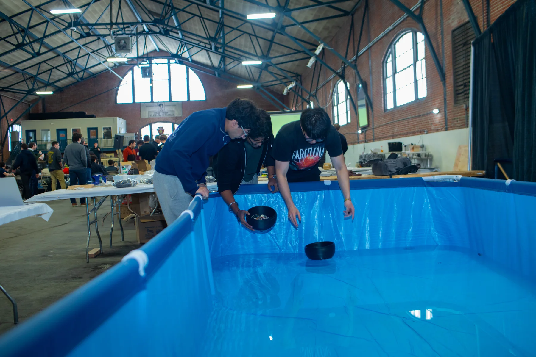 Nayel and teammates testing a waterborne prototype at Albacore's Maritime Hardware Hackathon